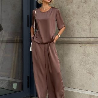 For stunning outfits in pastel tones, Women's silk pantsuit in a neutral color with belt would be perfect. This pants suit is simply a gem for the modern fashionista! Thanks to its breathable fabric, hot weather won't be a concern, and its classic style allows you to incorporate it into urban, professional, or romantic looks.