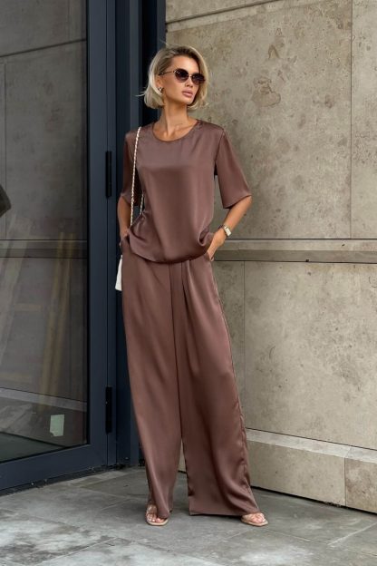 For stunning outfits in pastel tones, Women's silk pantsuit in a neutral color with belt would be perfect. This pants suit is simply a gem for the modern fashionista! Thanks to its breathable fabric, hot weather won't be a concern, and its classic style allows you to incorporate it into urban, professional, or romantic looks.